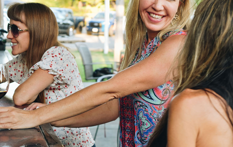 Photo of women at wine bar