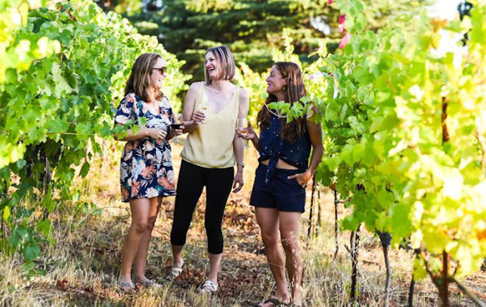 Photo of two women with wine
